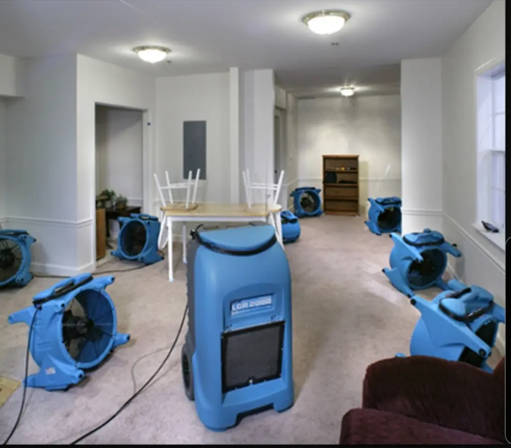 Air movers and dehumidifier setup for Water Damage Restoration in Diboll